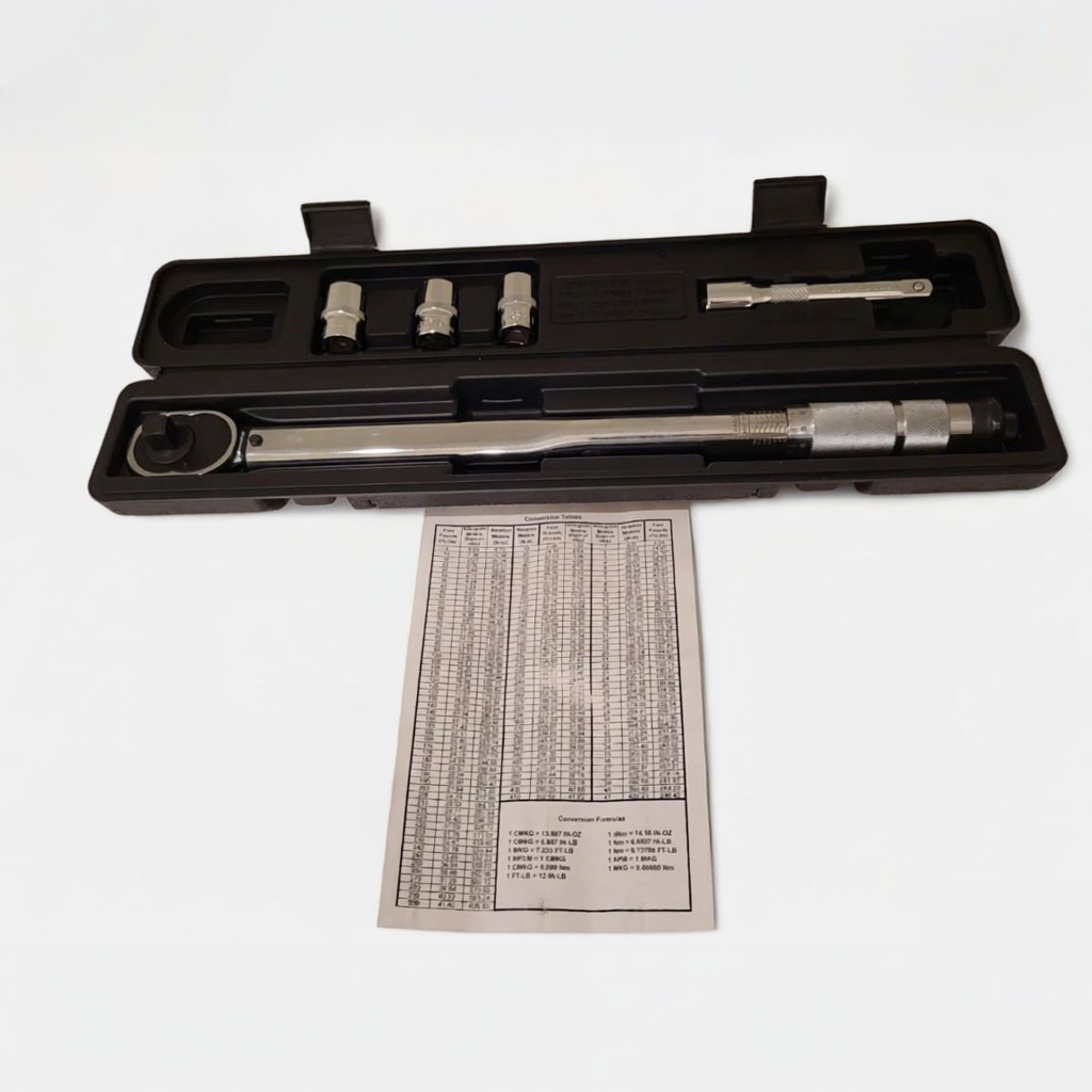 Close-up of the dual-direction ratchet head on a 1/2-inch click torque wrench, showing the direction selector