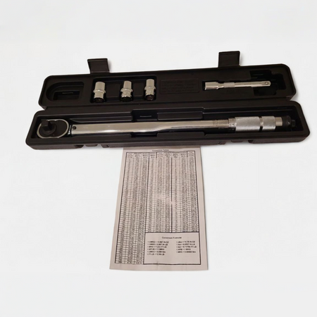 Close-up of the dual-direction ratchet head on a 1/2-inch click torque wrench, showing the direction selector