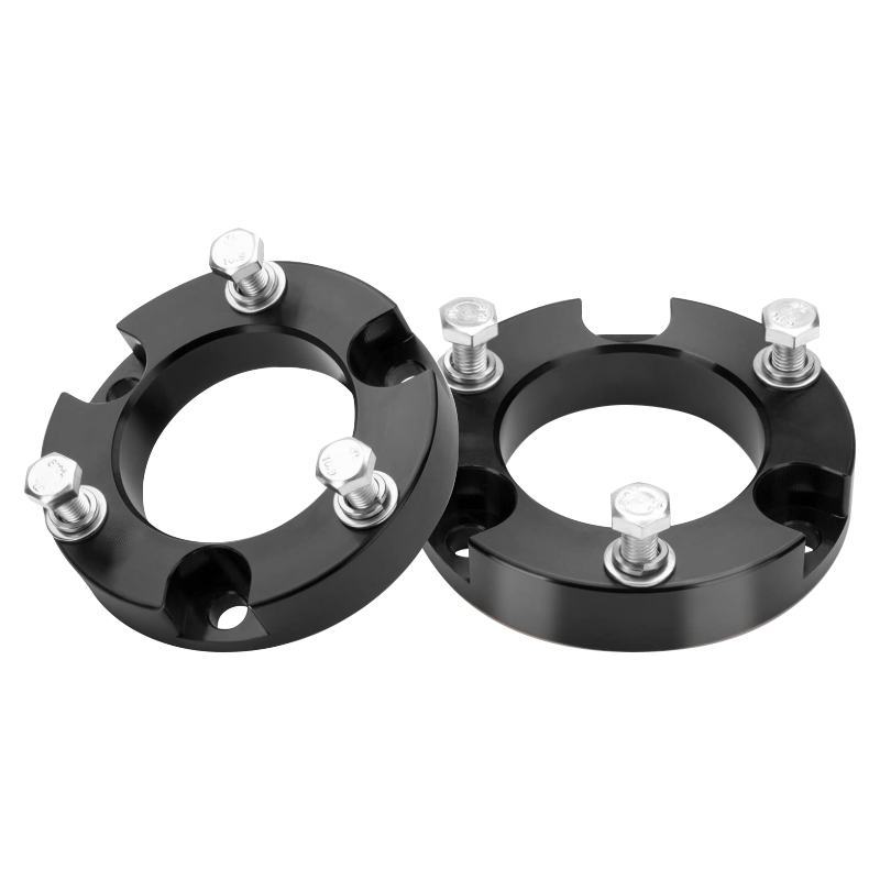 Aircraft-grade aluminum billet front lift spacers with 10.9 grade solid bolts, complete suspension hardware set on plain white background