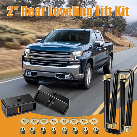 Pickup truck driving on off-road highway, display rear suspension lift hardware for truck modification