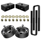 Steel lift kit paired with heavy‑duty u‑bolts, nuts and washers, full suspension hardware set displayed against plain white background